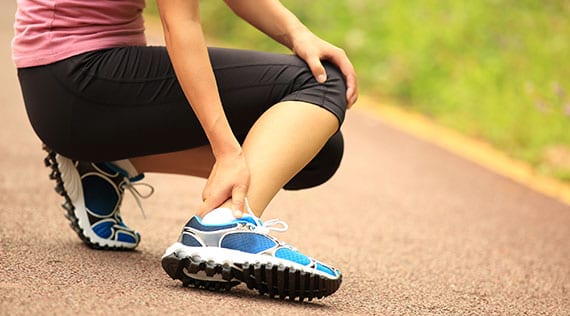 Female athlete dealing with foot trauma.