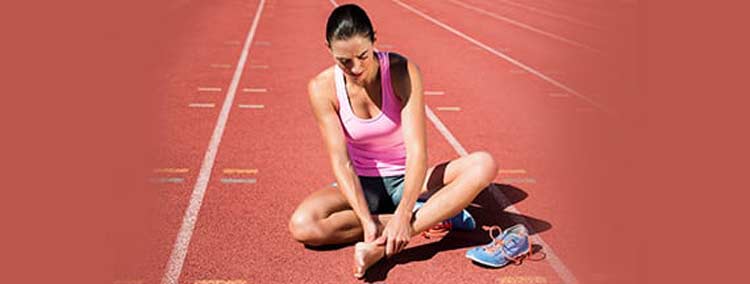Female athlete suffering from heel pain.