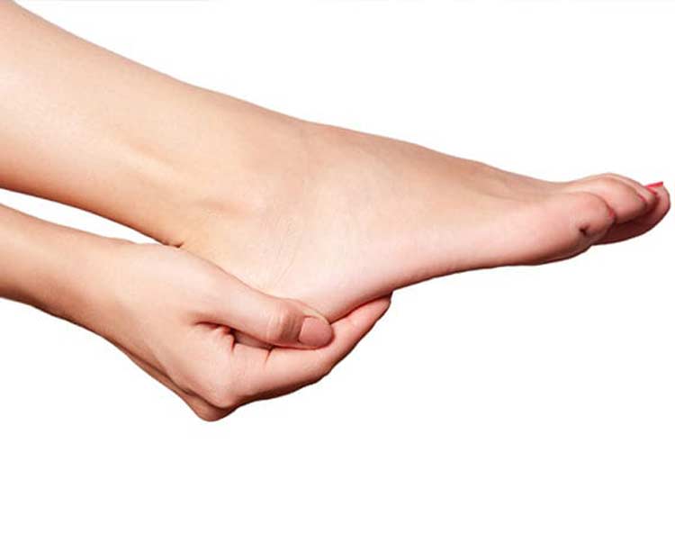 Person holding foot because of pressure ulcer.